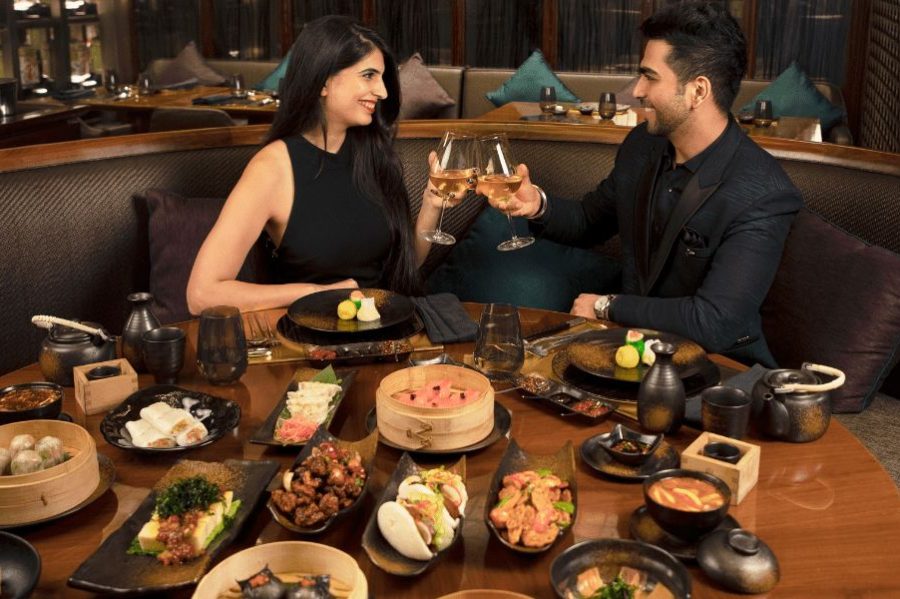 Couple dining at Conrad Pune Luxury by Hilton restaurant